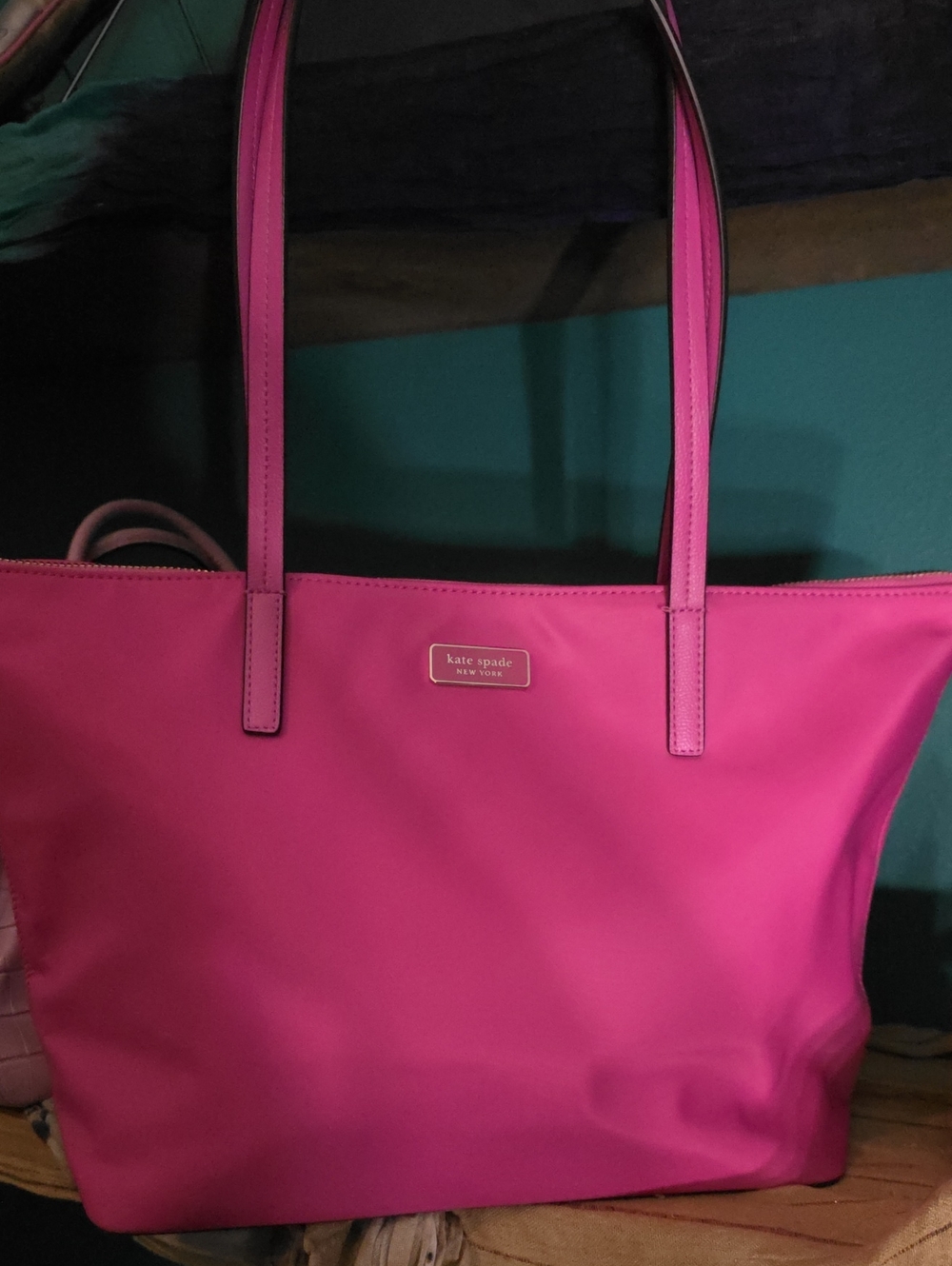 Kate Spade Hayden Top Zip Tote in a vibrant pink nylon material.